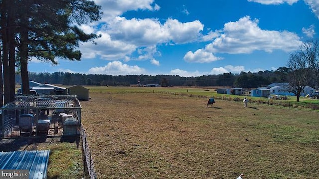 view of yard with a rural view