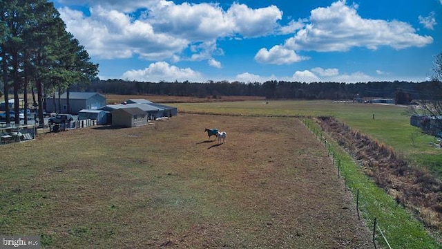 birds eye view of property with a rural view