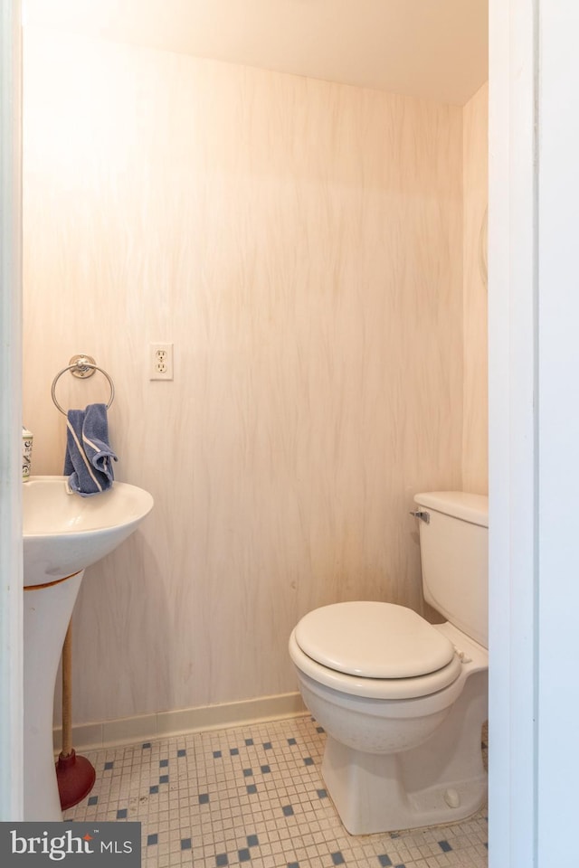 bathroom with tile patterned floors and toilet