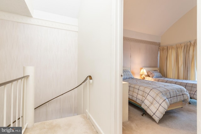 bedroom featuring carpet flooring and vaulted ceiling