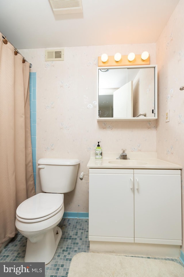 bathroom featuring tile patterned floors, vanity, toilet, and a shower with shower curtain