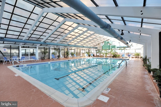 view of pool featuring a lanai