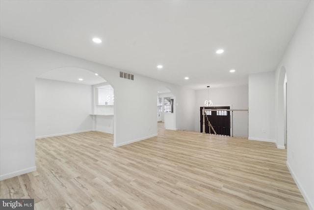 unfurnished living room featuring light hardwood / wood-style flooring