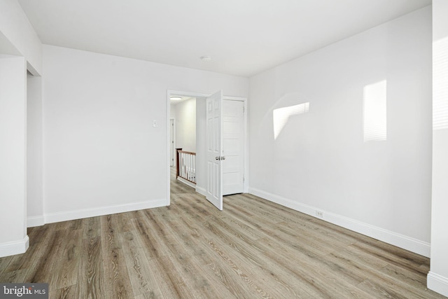 unfurnished bedroom with light wood-type flooring