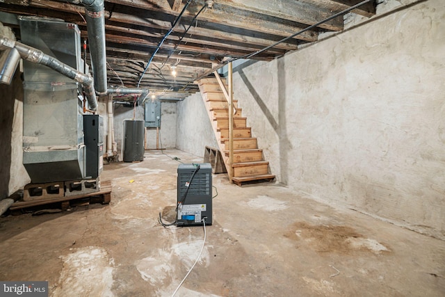 5907 Osage Ave, Philadelphia, PA 19143 - unfinished below grade area featuring stairway, electric panel, and heating unit