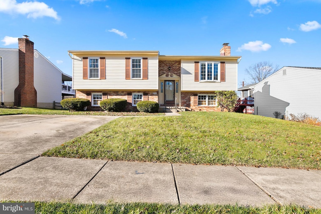 bi-level home with a front yard