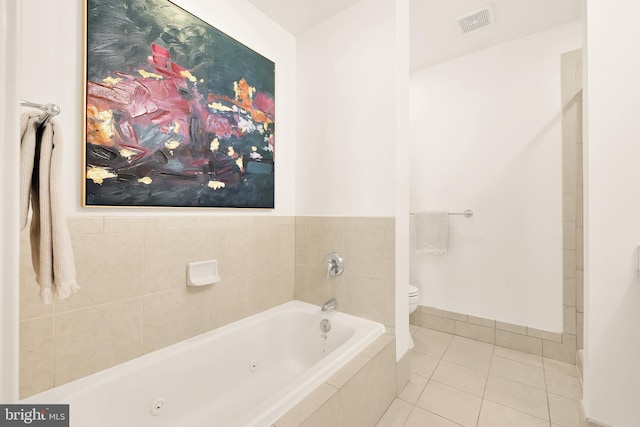 full bathroom with visible vents, baseboards, toilet, tile patterned floors, and a tub with jets