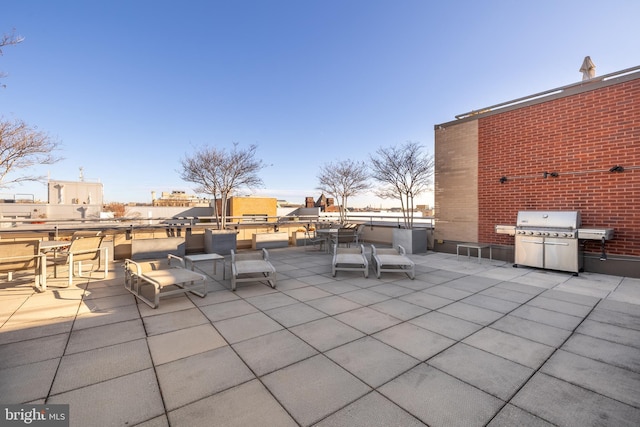 view of patio with outdoor dining space and grilling area