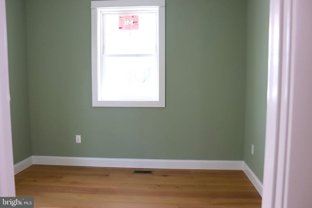 unfurnished room with light hardwood / wood-style floors