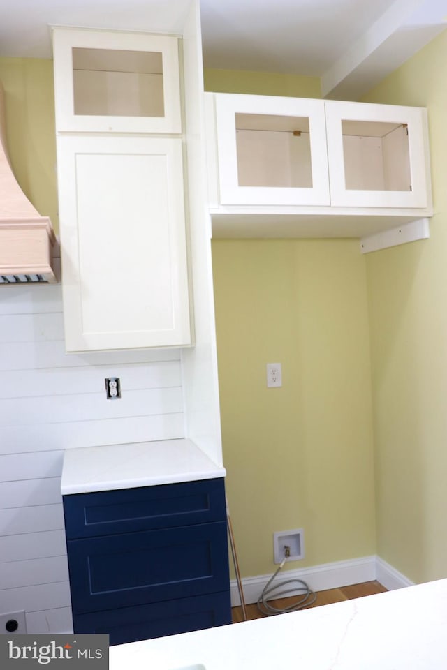 laundry room with hardwood / wood-style floors and hookup for a washing machine