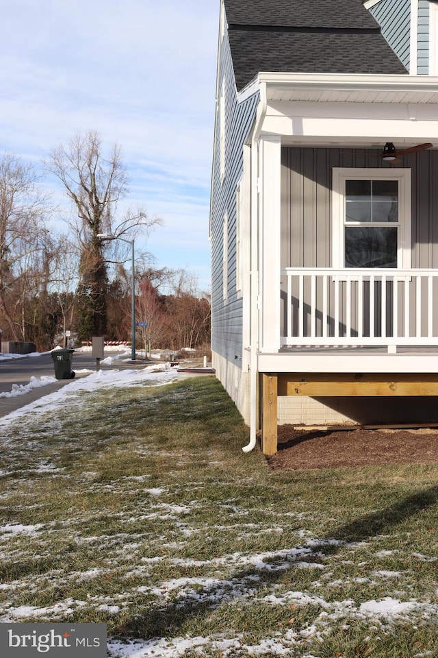 snow covered property featuring a yard