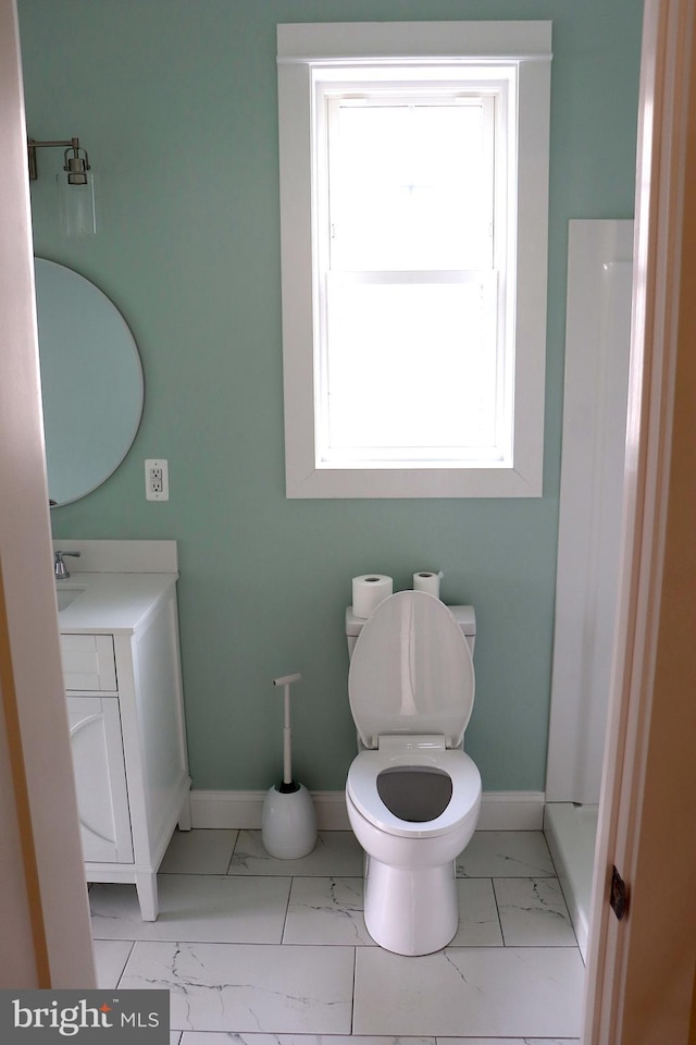 bathroom featuring vanity and toilet