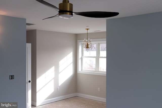 interior space featuring ceiling fan with notable chandelier