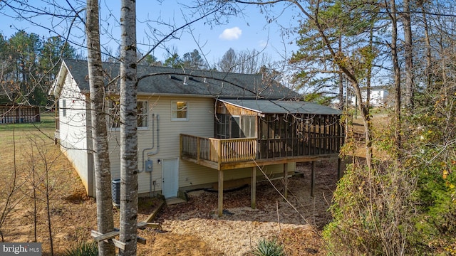 back of house with a wooden deck