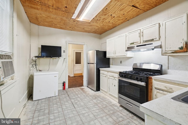 kitchen featuring stainless steel appliances and white cabinetry