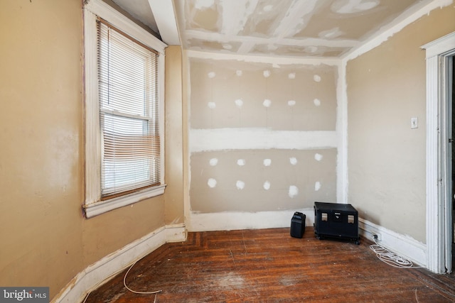 empty room with dark wood-type flooring