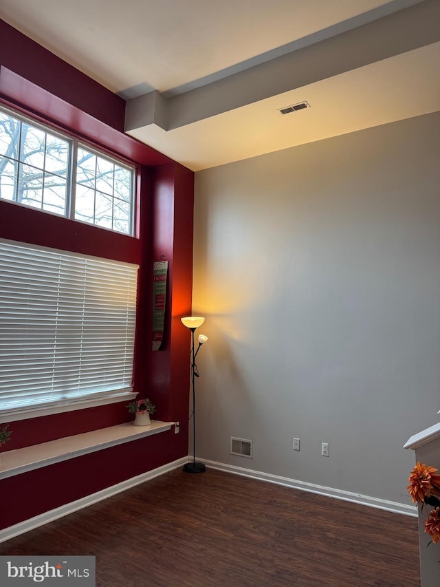 spare room featuring dark hardwood / wood-style floors