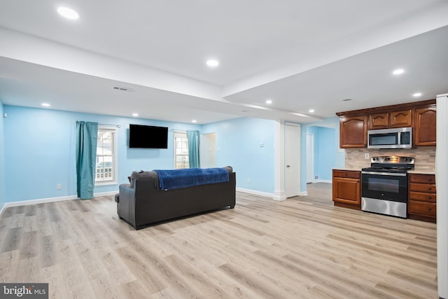 living room with light hardwood / wood-style flooring