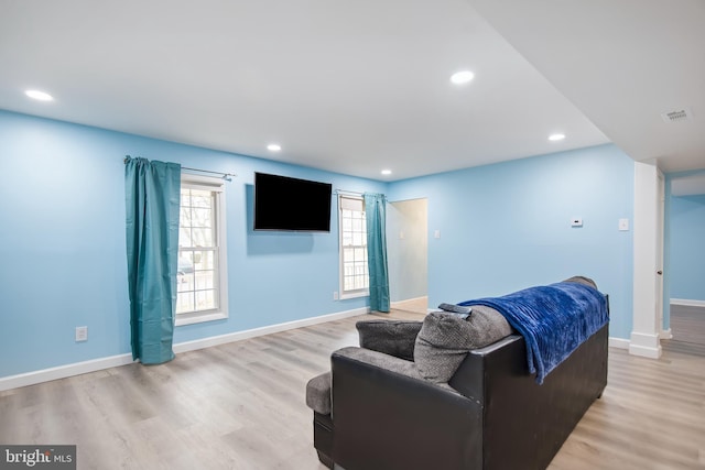 living room with light hardwood / wood-style flooring