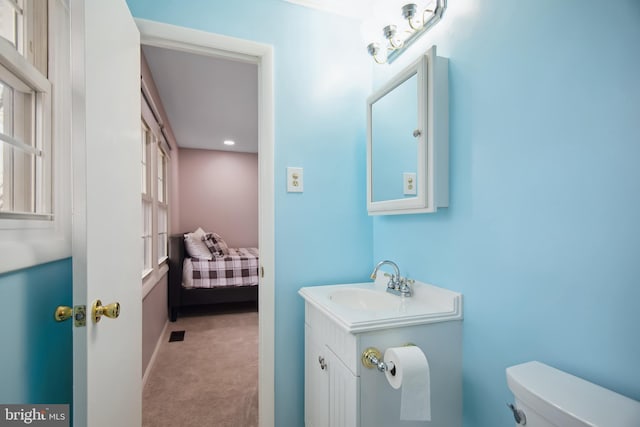 bathroom featuring vanity and toilet