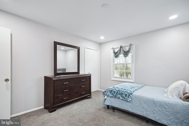 carpeted bedroom with a closet