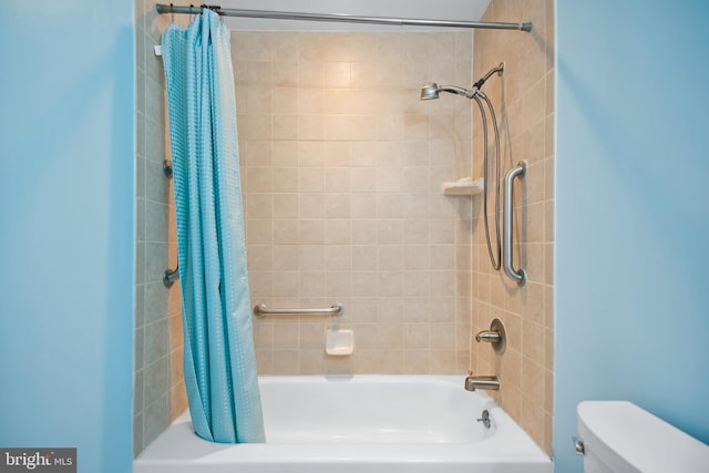 bathroom with shower / bath combo with shower curtain and toilet