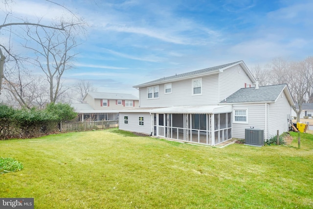 back of property with a lawn, central AC, and a sunroom