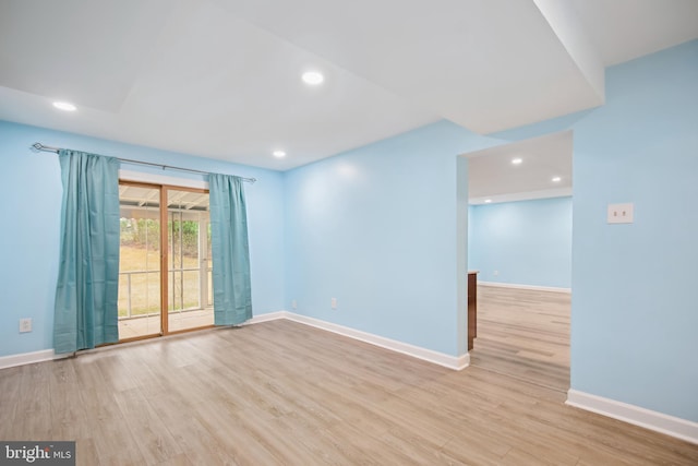 spare room with light wood-type flooring