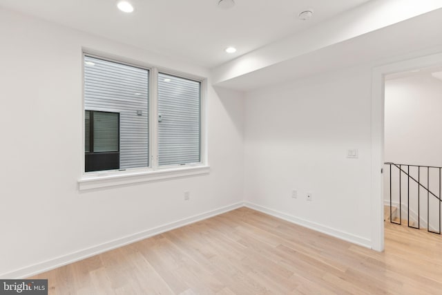 spare room featuring light hardwood / wood-style flooring