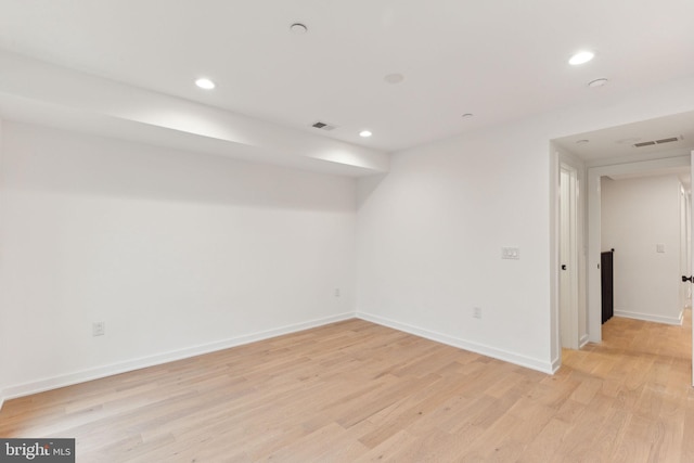 spare room with light hardwood / wood-style flooring