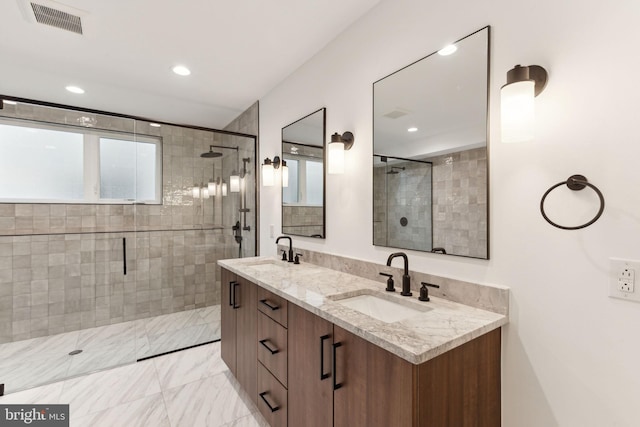 bathroom with vanity and an enclosed shower