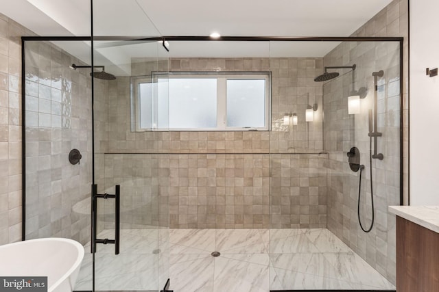 bathroom with shower with separate bathtub