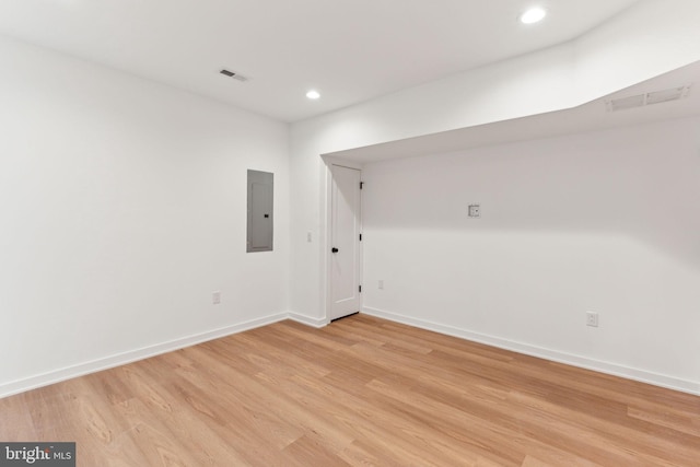 interior space with light wood-type flooring and electric panel