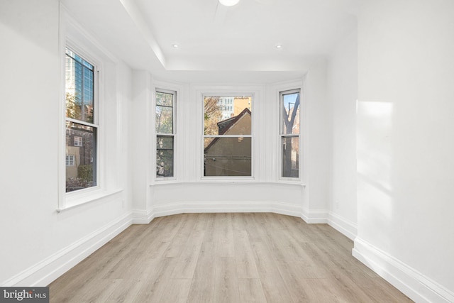 spare room with light hardwood / wood-style floors