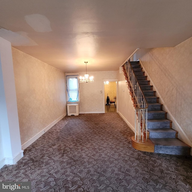 interior space featuring radiator heating unit and a chandelier