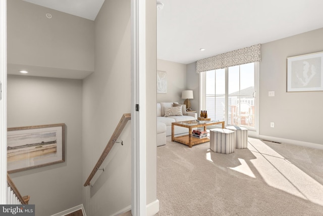 living room featuring light colored carpet