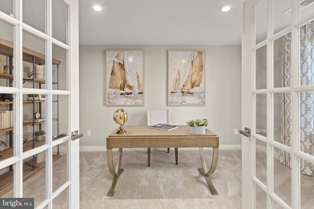 carpeted home office with french doors