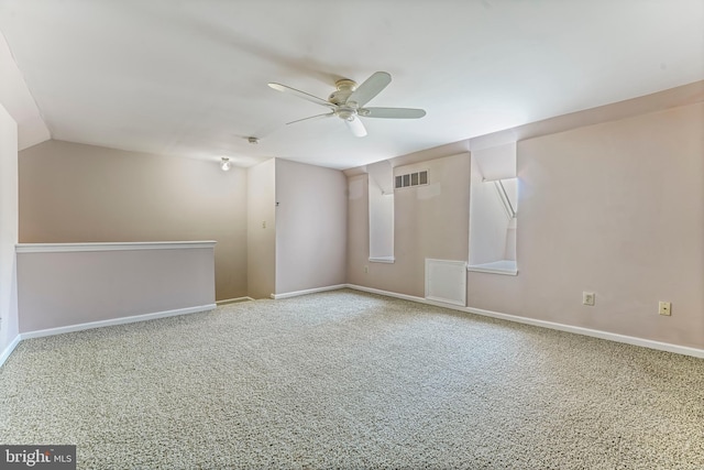 unfurnished room featuring carpet flooring, ceiling fan, and lofted ceiling