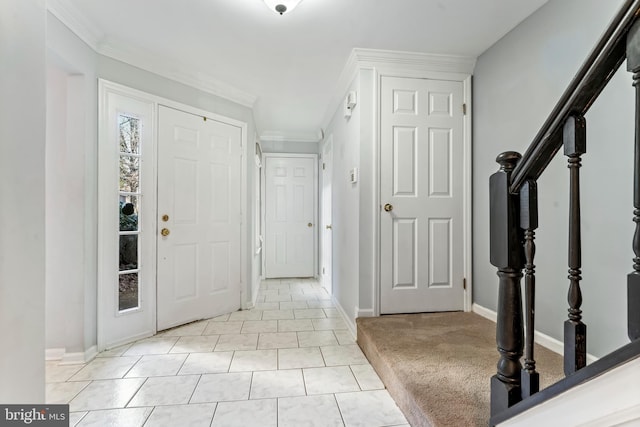 foyer entrance featuring light colored carpet and crown molding