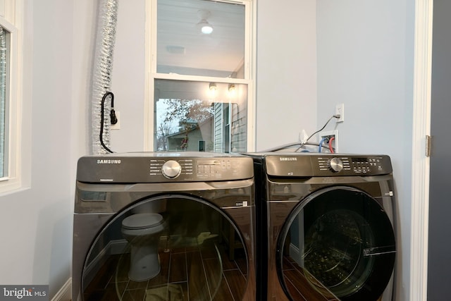 washroom with washing machine and clothes dryer