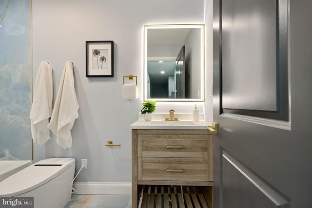 bathroom with vanity and toilet