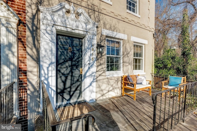 entrance to property with a deck