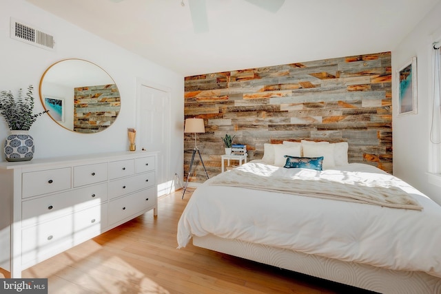 bedroom featuring light hardwood / wood-style flooring and ceiling fan