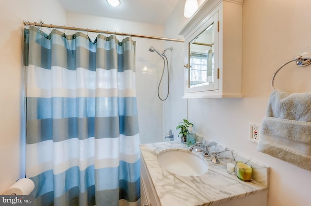 bathroom with vanity and a shower with shower curtain