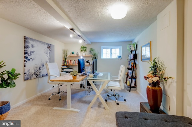 carpeted office with a textured ceiling