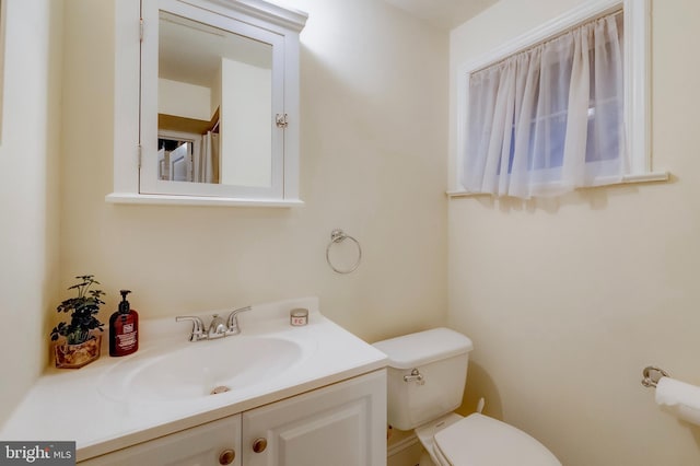 bathroom with vanity and toilet