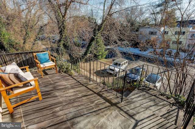 wooden terrace featuring a grill