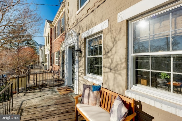 wooden terrace featuring covered porch