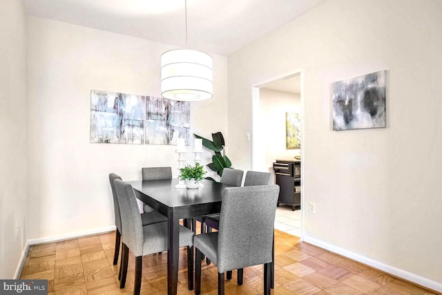 dining area with light parquet floors