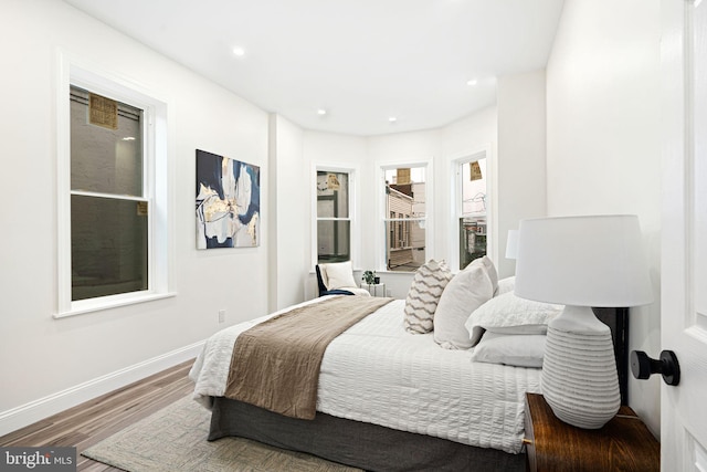 bedroom with hardwood / wood-style floors